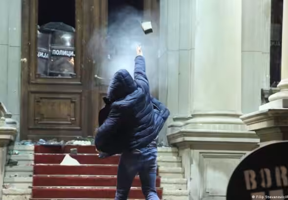 Protestors throw rocks staging a protest in front of Belgrade City Council building objecting to the result of general and local elections, in Belgrade, Serbia on December 24, 2023. Photo: Filip Stevanovic/Anadolu via Getty Images.