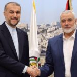 Iran's Foreign Minister Hossein Amir-Abdollahian (L) shakes hands with Ismail Haniyeh, head of the political bureau of the Palestinian Hamas resistance group, in Doha, Qatar, on December 20, 2023. Photo: the Iranian Foreign Ministry.