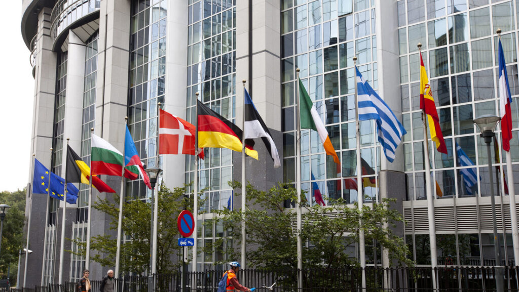 The headquarters of the European Union in Brussels, Belgium, with flags of the EU member countries. File photo.