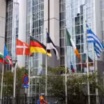 The headquarters of the European Union in Brussels, Belgium, with flags of the EU member countries. File photo.