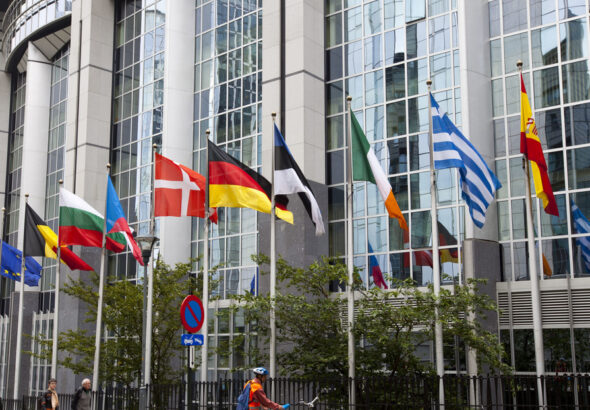The headquarters of the European Union in Brussels, Belgium, with flags of the EU member countries. File photo.