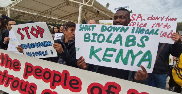 People in Kenya protesting biolabs with banners that read “shut down illegal biolabs in Kenya.” Photo: Batko Milacic.