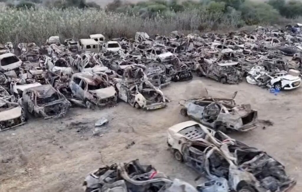 Drone footage released by the Israeli military in November shows the extent of the destruction of the cars fleeing the Supernova rave on October 7, likely inflicted by Israeli drones and helicopters. Photo: RT/Israeli military.