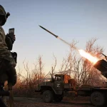 Russian servicemen fire a BM-21 Grad multiple rocket launcher towards Ukrainian positions, in the Donetsk People's Republic, Russia, October 28, 2023. Photo: Stanislav Krasilnikov/Sputnik.