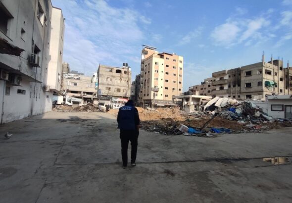 Journalist Yousef Fares stands in front of a destroyed city block in Northern Gaza on December 28, 2023. Photo: Yousef Fares Telegram.