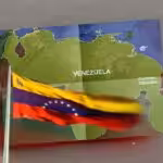 The flag and map of Venezuela including the territory of Essequibo. Photo: Al Mayadeen/File photo.
