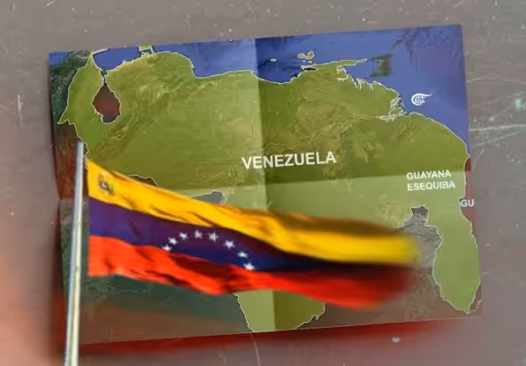 The flag and map of Venezuela including the territory of Essequibo. Photo: Al Mayadeen/File photo.