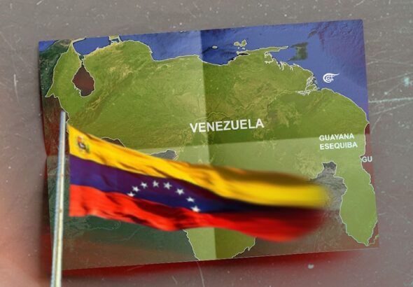 The flag and map of Venezuela including the territory of Essequibo. Photo: Al Mayadeen/File photo.