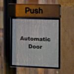 'Push: Automatic Door.' reads a sign. Photo: Substack.