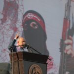 Deputy Secretary-General of the Popular Front for the Liberation of Palestine, Jamil Mezher, during the central festival commemorating the 55th anniversary of the Front’s launch in Al-Katiba Square in Gaza City on December 2022. Photo: Ali Jadallah/File photo.