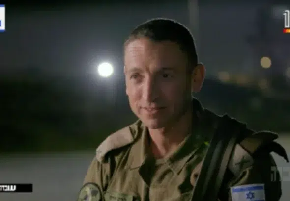 Brigadier General Barak Hiram on Israeli media casually admitting the war crimes he committed, such as killing 12 Israeli civilians (including children) in their homes. Photo: Uvda.