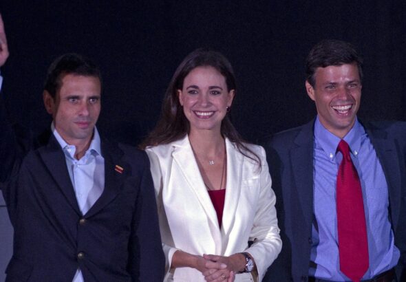 A photo from early 2000s showing Venezuelan far-right politicians María Corina Machado (center) accompanied by Henrique Capriles (left) and Leopoldo López (right). Photo: Getty Images/File photo.
