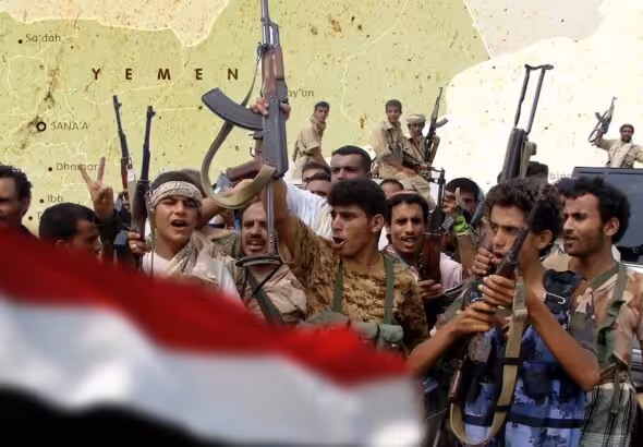Photo composition showing Yemeni fighters raising their machine guns next to the Yemen flag with the map of Yemen in the background. Photo: Al Mayadeen.