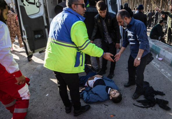 Iranian emergency services arrive at the site in Kerman, Iran, where two explosions killed at least 103 people. Photo: MEHR News.