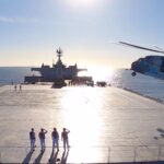 This image made from a video released Jan. 13, 2021, by the Iranian Army shows a helicopter landing on the Makran logistics vessel during a navy drill. Photo: PressTV.