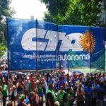 Argentinians march with a huge banner of the workers' union Workers' Central of Argentina (CTA). File photo.