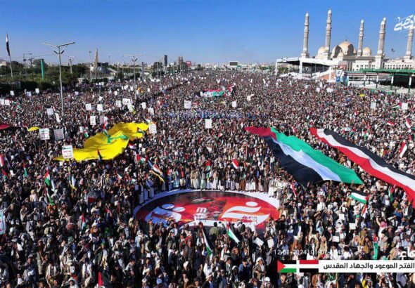 Millions of people rally in Sana'a Yemen on January 12th, 2024 against the US/UK aggression and in solidarity with Palestine. Very large flags of Yemen, Palestine, and Hezbollah can be seen. Photo: Ansarallah Military Media Telegram.