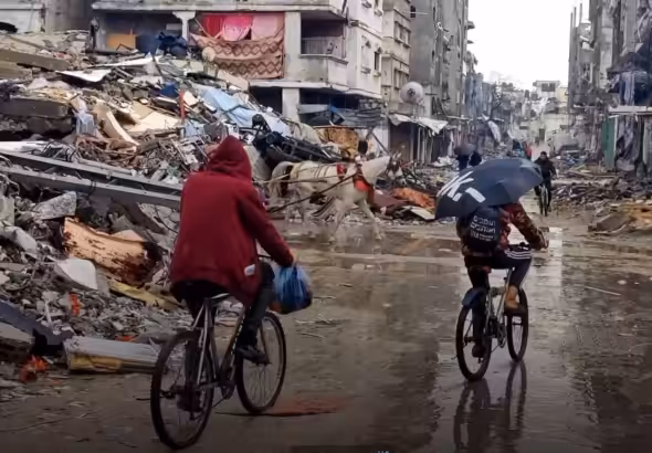 Palestinians outside Jabalia Refugee camp in Northern Gaza traverse the ruins on bicycles and horses on January 25, 2024. Photo: Mohammad Balousha/Yousef Fares Telegram.