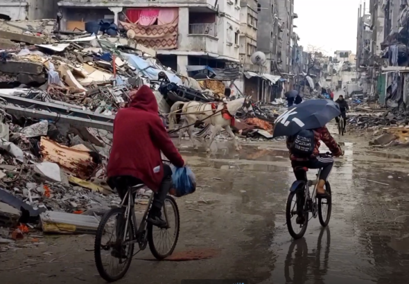 Palestinians outside Jabalia Refugee camp in Northern Gaza traverse the ruins on bicycles and horses on January 25, 2024. Photo: Mohammad Balousha/Yousef Fares Telegram.