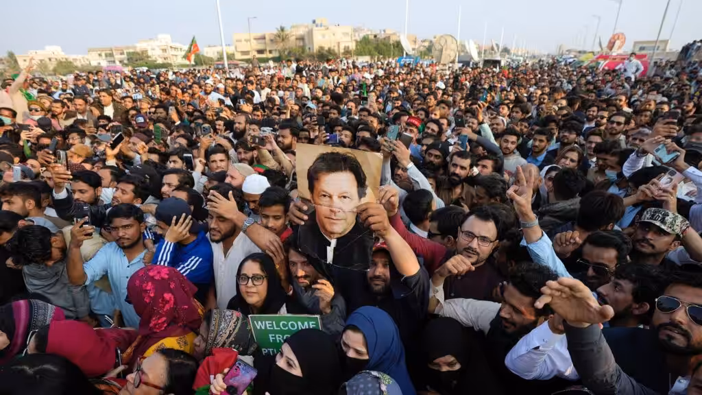 Imran Khan supporters rally with the ex-prime minister's picture. File photo.