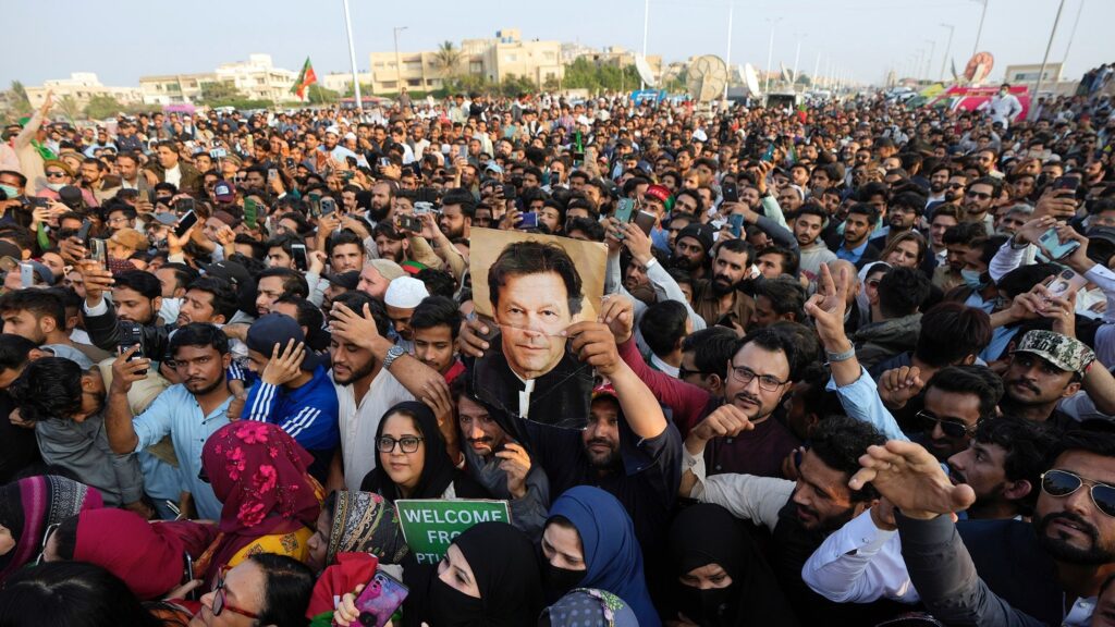 Imran Khan supporters rally with the ex-prime minister's picture. File photo.