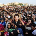 Imran Khan supporters rally with the ex-prime minister's picture. File photo.