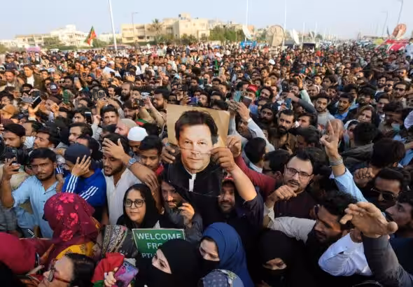 Imran Khan supporters rally with the ex-prime minister's picture. File photo.