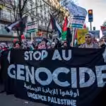 Protesters call for an end to the genocide in Gaza during a demonstration in Paris, 17 December. Photo: Anne Paq Active Stills.
