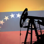 Photo collage composition displaying an oil rig with a Venezuelan flag in the background. Photo: Anton Watman/Shutterstock.