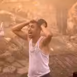 A Palestinian man looks devastated after a building in Khan Yunis in Gaza was demolished by an Israeli airstrike on 6 November, 2023. Photo: AFP.