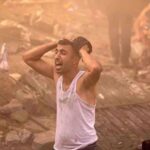 A Palestinian man looks devastated after a building in Khan Yunis in Gaza was demolished by an Israeli airstrike on 6 November, 2023. Photo: AFP.