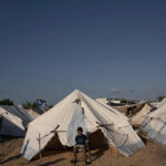 A Palestinian child now a refugee living in this tent because of the Israeli genocide. Photo: Getty Images.