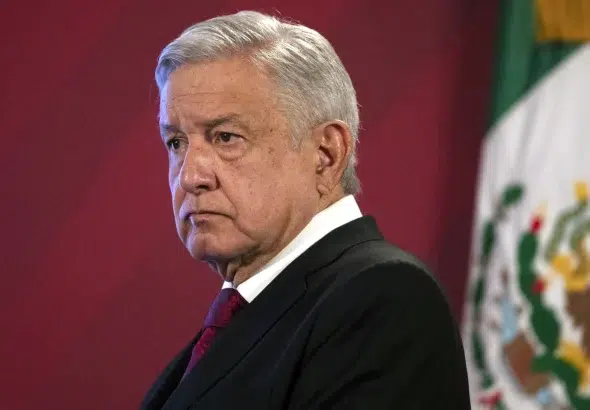 Mexico's President Andres Manuel Lopez Obrador arrives for his daily, morning news conference at the presidential palace, Palacio Nacional, in Mexico City, on July 13, 2020. Photo: Marco Ugarte/AP file.