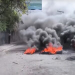 A burning tire barricade in Port-au-Prince on Feb. 6, the second of three days of intense protests which were unsuccessful in forcing de facto Prime Minister Ariel Henry from power. Photo: Haïti Liberté.