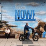 Zionist mural in Occupied Palestine depicts Israeli occupation bombers and a tank and settlers hugging with the phrase "Bring them home NOW!" Nov. 23, 2023. Photo: Associated Press