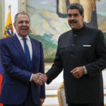 Russian Foreign Affairs Minister Sergey Lavrov (left) and Venezuelan President NicolĂĄs Maduro (right) shake hands in Miraflores Palace, Caracas, February 20, 2024. Photo: AP/Ariana Cubillos.