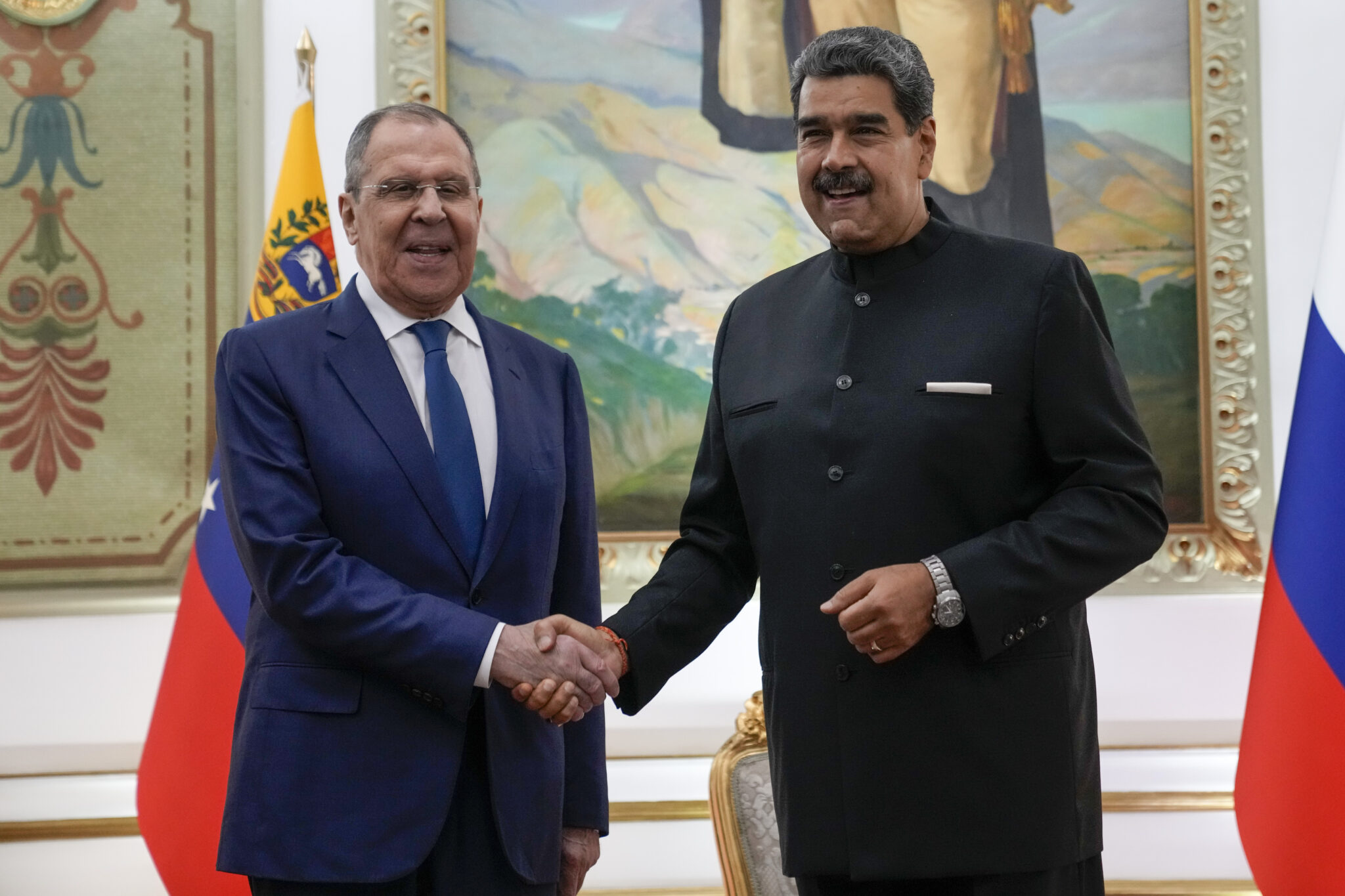 Russian Foreign Affairs Minister Sergey Lavrov (left) and Venezuelan President Nicolás Maduro (right) shake hands in Miraflores Palace, Caracas, February 20, 2024. Photo: AP/Ariana Cubillos.