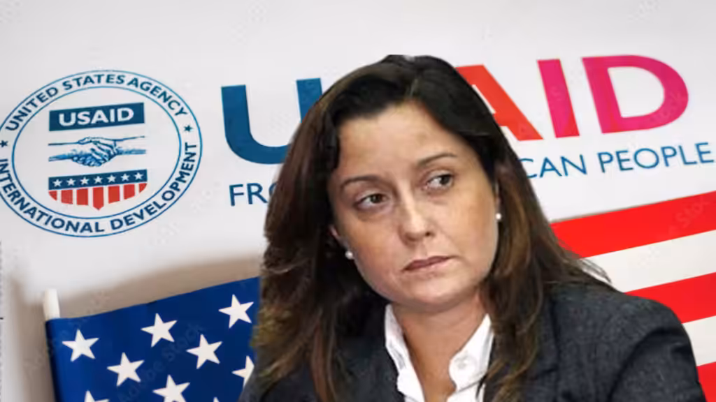 Photo composition showing US-supported NGO activist Rocío San Miguel with a background showing the USAID logo and the US flag. Photo: Orinoco Tribune.