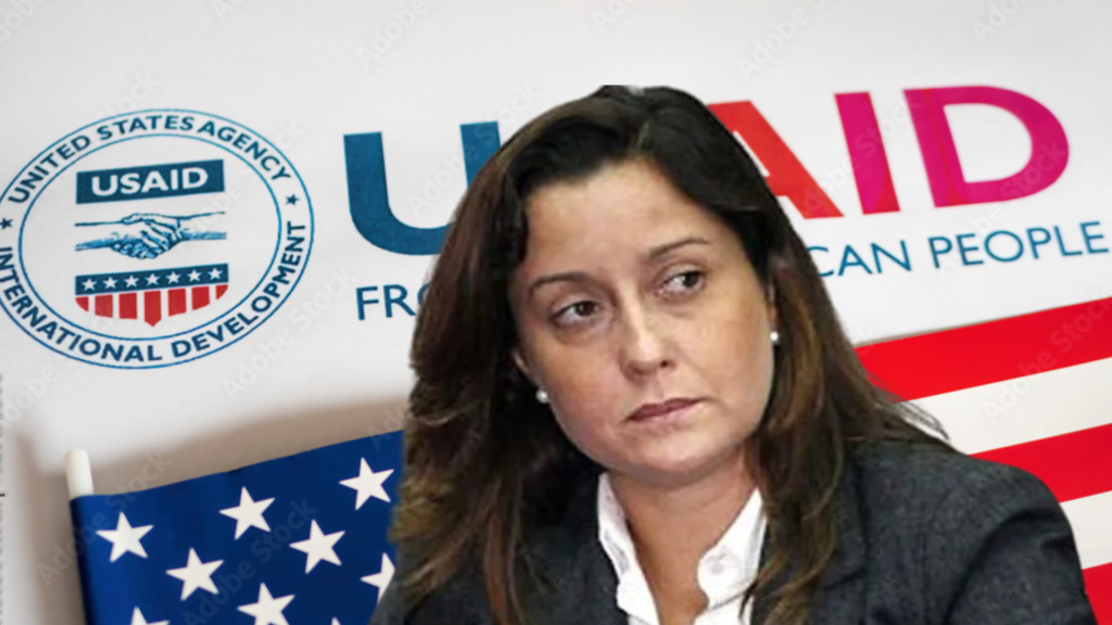 Photo composition showing US-supported NGO activist Rocío San Miguel with a background showing the USAID logo and the US flag. Photo: Orinoco Tribune.