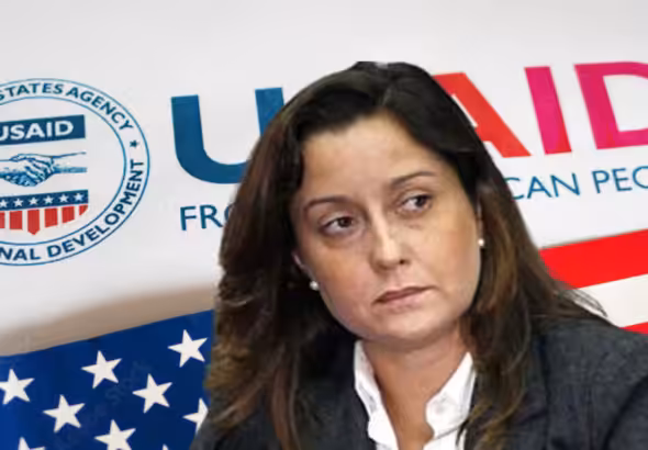 Photo composition showing US-supported NGO activist Rocío San Miguel with a background showing the USAID logo and the US flag. Photo: Orinoco Tribune.