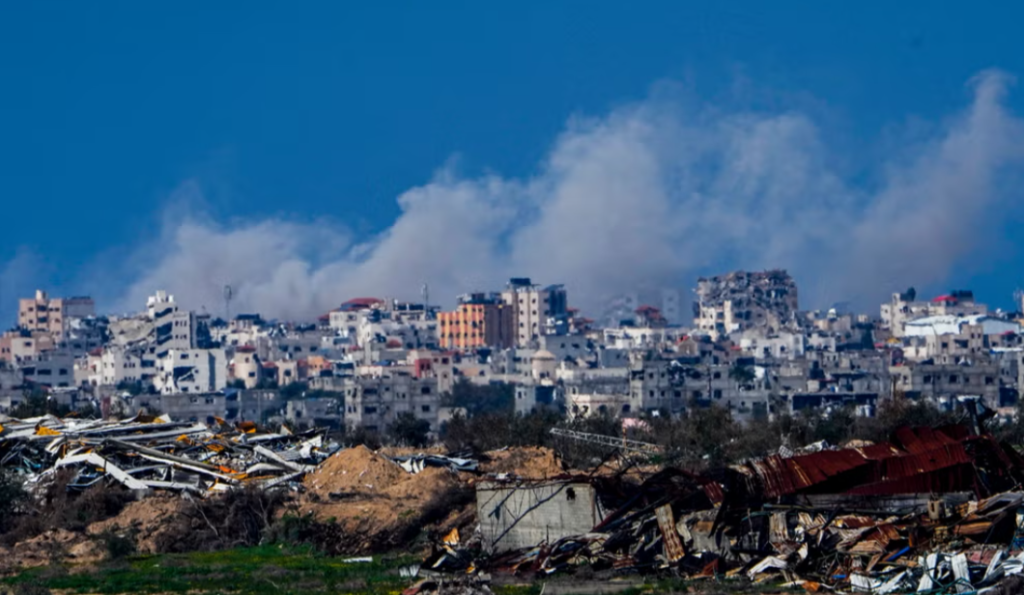 Smoke rises following an Israeli bombardment in the Gaza Strip, as seen from southern occupied Palestine, Sunday, Feb. 4. Photo: AP.