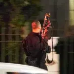 US Secret Service agent holding a machine gun while raiding the Venezuelan Ambassador Residence in Washington DC on Thursday, February 15, 2024. Photo: X/@PenguinSix.