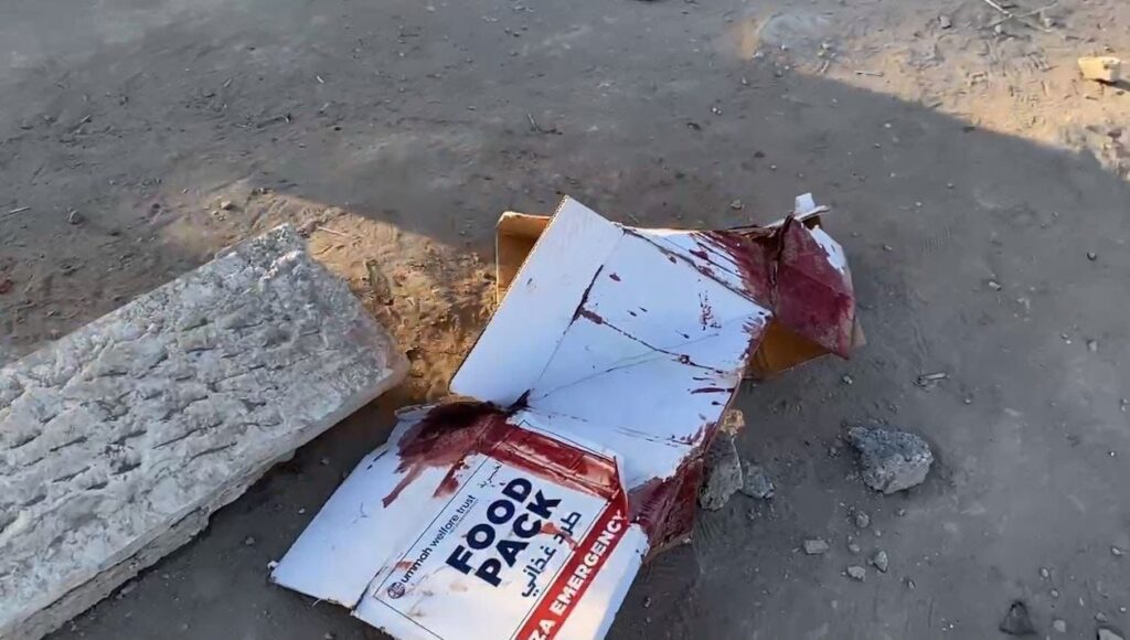 A smashed box of humanitarian food aid stained with blood, after the latest massacre by Israeli occupation forces that killed at least 104 people in Al-Nabulsi, Palestine, on February 29, 2024. Photo: X/@madhoun95.