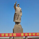 Statue of Chairman Mao Zedong in Kashgar, Xinjiang Uyghur Autonomous Region. Red banner reads: ‘Forge ahead on a new journey and build a new era.’ WW Photo: Arjae Red.
