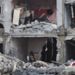 Palestinians amid the wreckage of a house in Rafah destroyed by Israeli bombardment, February 14, 2024. Photo: AP.