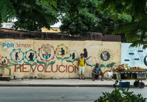 A mural in Cuba with the words "Revolution forever." Photo: Guille Álvarez.