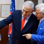 Israeli Prime Minister Benjamin Netanyahu holds the NFL Super Bowl trophy during a meeting with New England Patriots owner Robert Kraft in Jerusalem, June 20, 2019. Photo: Sebastian Scheiner/AP.