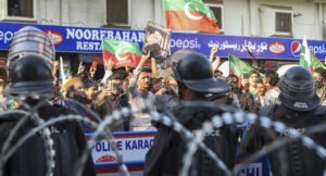 Supporters of former Prime Minister Imran Khan’s Pakistan Tehreek-e-Insaf (PTI) protest against the alleged skewing in Pakistan's national election results, in Karachi on February 11, 2024. Photo by AFP.