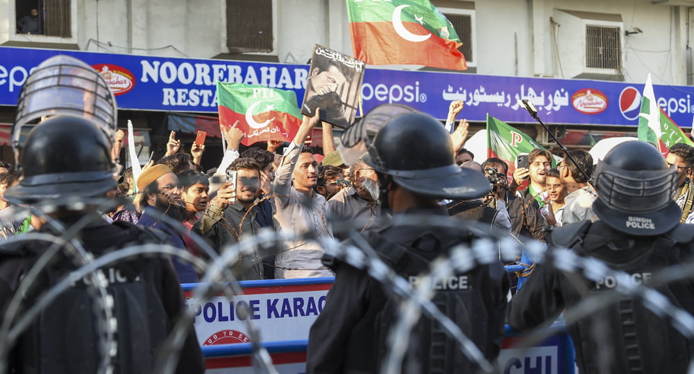 Supporters of former Prime Minister Imran Khan’s Pakistan Tehreek-e-Insaf (PTI) protest against the alleged skewing in Pakistan's national election results, in Karachi on February 11, 2024. Photo by AFP.