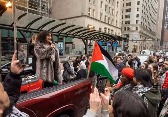 Chicago Alderwoman Rossana Rodriguez-Sanchez speaking to the rally following the passage of her Palestine resolution. Photo: Fight Back! News/Alec Ozawa.